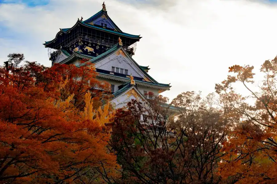 Osaka Castle with autumn foliage in the castle grounds